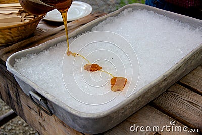 Making maple syrup taffy at the sugar shack in Quebec Stock Photo